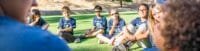 Pali Institute students sit in a circle on the lawn