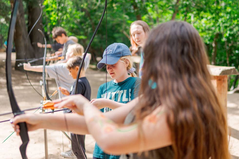 Students at the archery range with an instructor supervising at Pali Institute