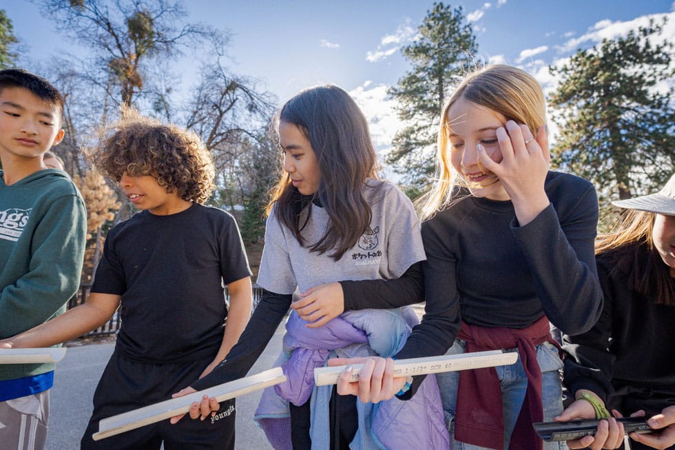 Students working together on a team-building challenge at Pali Institute